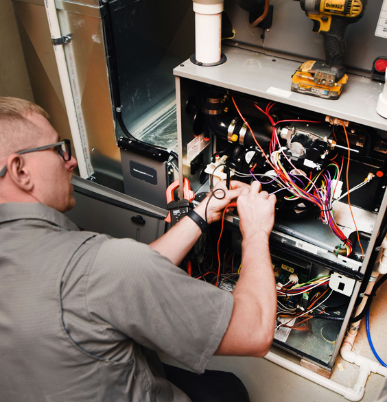 Commercial Heating Employee working on commercial heating system